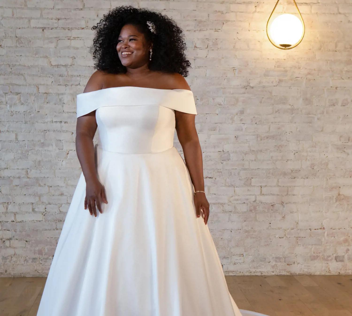 Photo of Model wearing a Blush Bridal Salon Plus Size Collection Gown